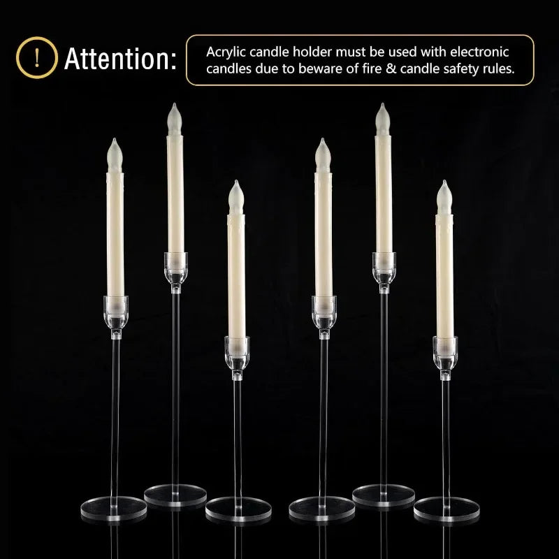 Six tall, clear acrylic candle holders from candletown.net with white electronic candles create a striking modern aesthetic against a black background. A safety message reads: Attention: Use only with electronic candles for fire & candle safety. Ideal for home decor.